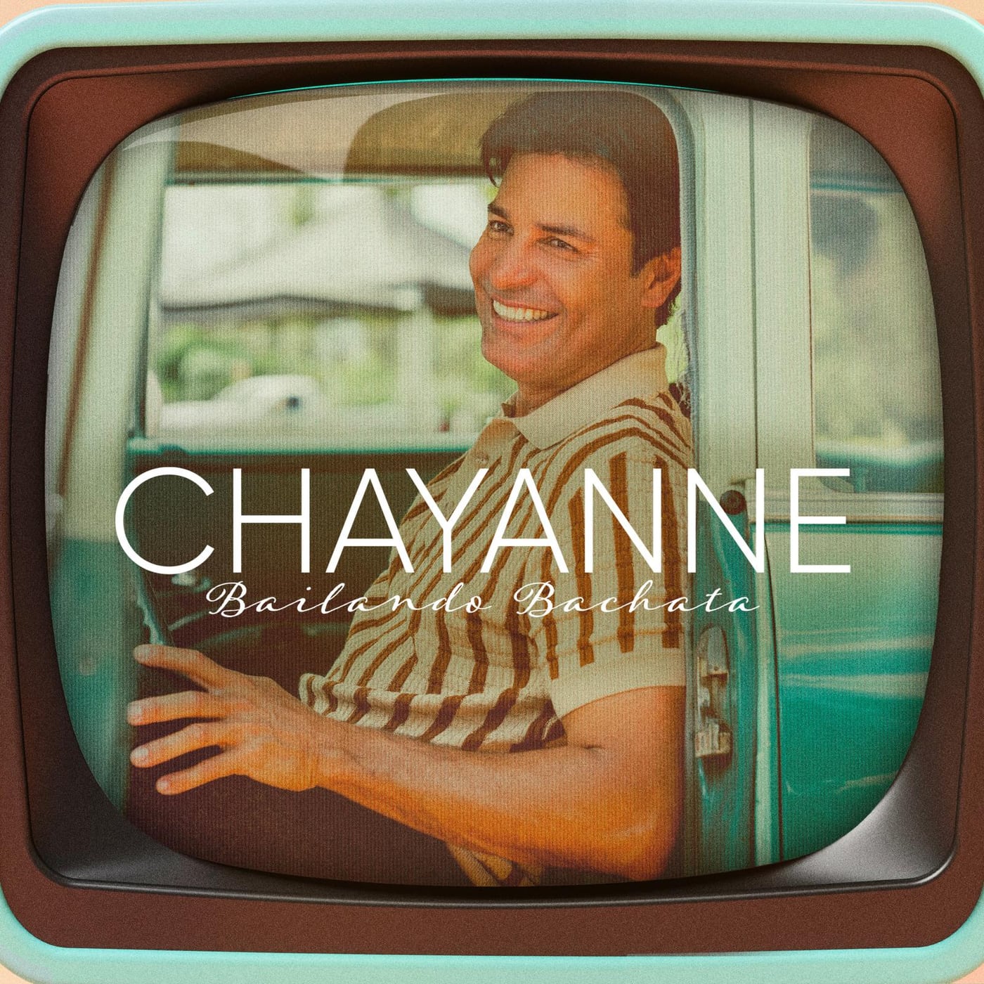 Chayanne at the wheel of a vintage car on the cover art for “Bailando Bachata”