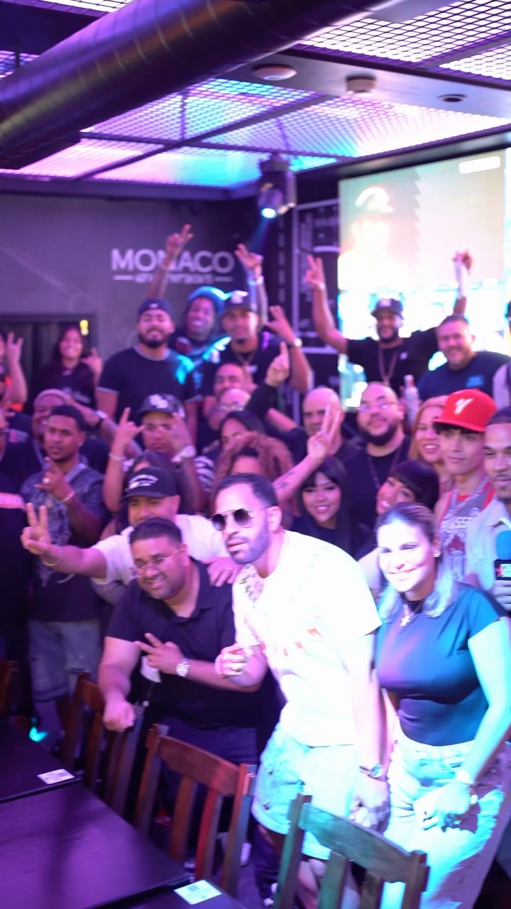 A group photo from LMP's meet & greet with Boy Wonder CF, Chosen Few and LMP's DJs — about thirty people, many with hands raised to the camera