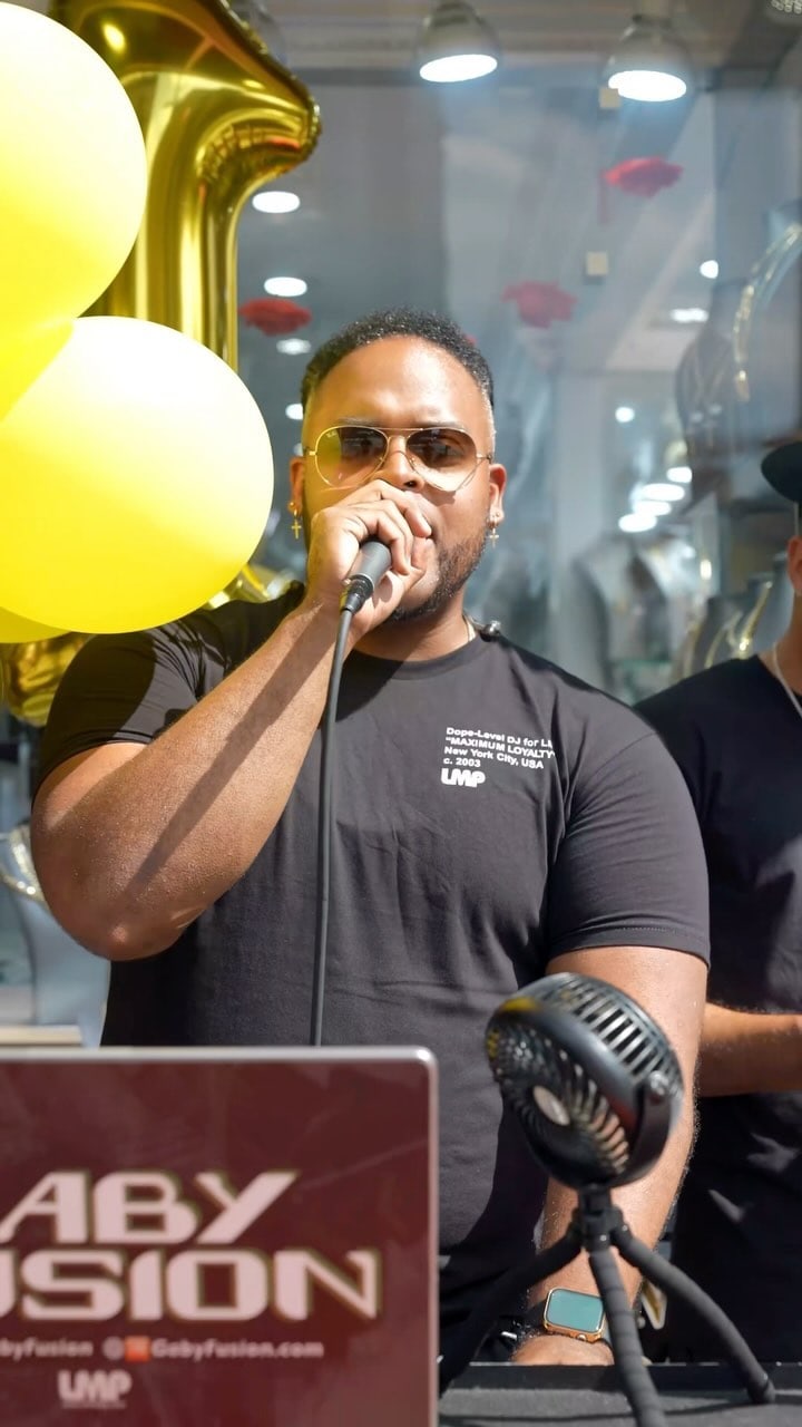A host on the mic at the raffle, from the collab reel