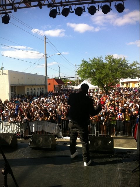 Fuego on the LMP stage at Calle 8 in Miami, a street crowd in front of him