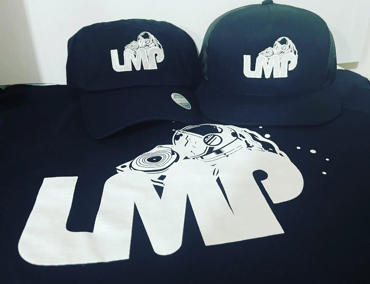 LMP caps and a T-shirt — the LMP DJs' 2022 gear