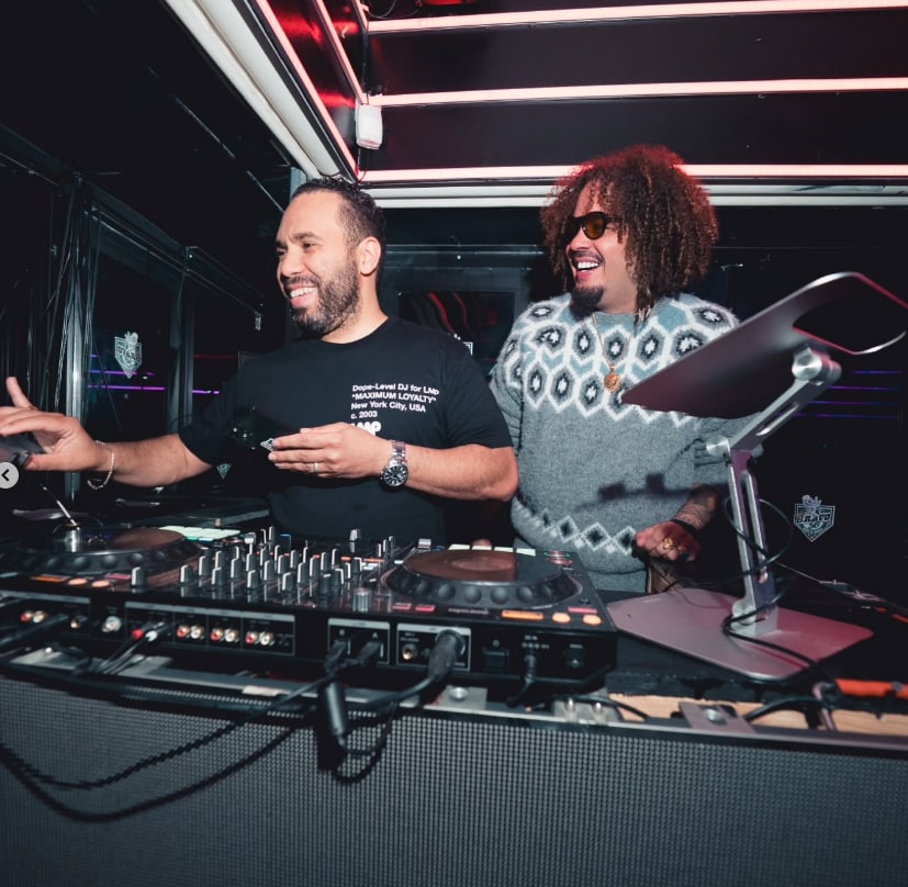 Maffio beside an LMP DJ at the decks at Bravo 56