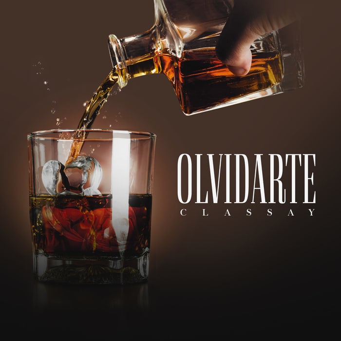 Cover art for “Olvidarte” by Classay — a drink being poured over ice