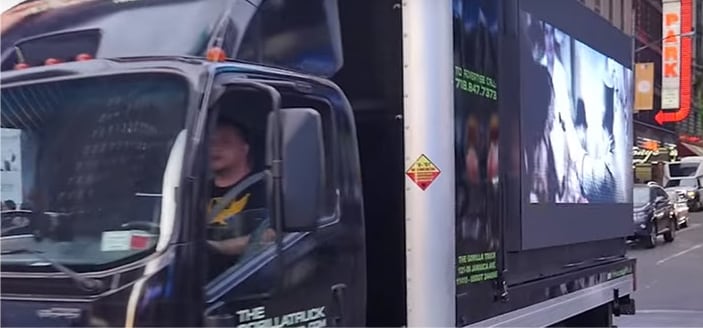 The screen truck in Times Square traffic
