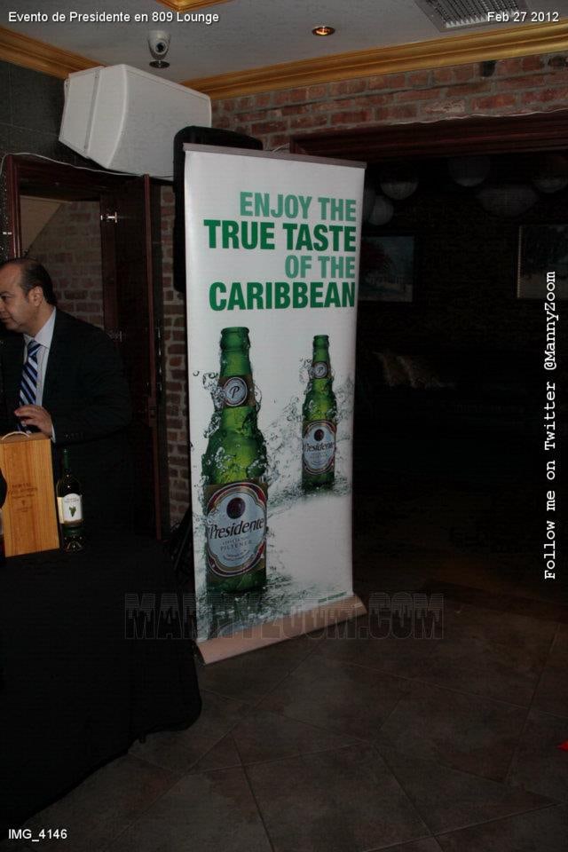 A Presidente “Enjoy the true taste of the Caribbean” banner inside 809 Lounge