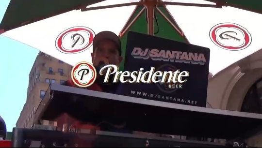 Presidente's float at the Dominican Day Parade, with a DJ Santana sign