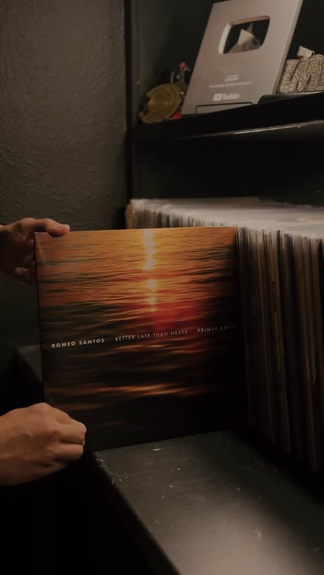 The Better Late Than Never vinyl being pulled from a crate in LMP's Vinyl & Culturas session