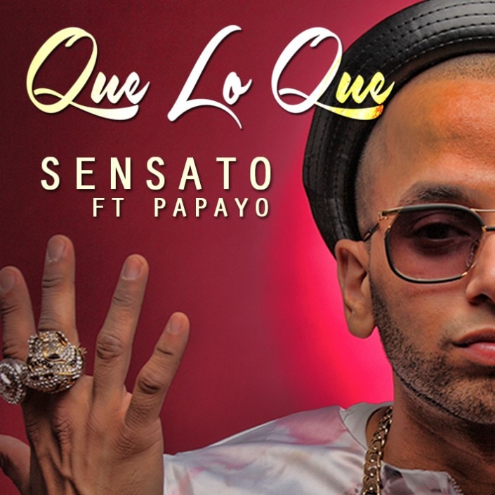 The “Que Lo Que” art from LMP's 2014 homepage feature — “Sensato ft Papayo”, Sensato in a black hat and tinted glasses, his ringed hand raised