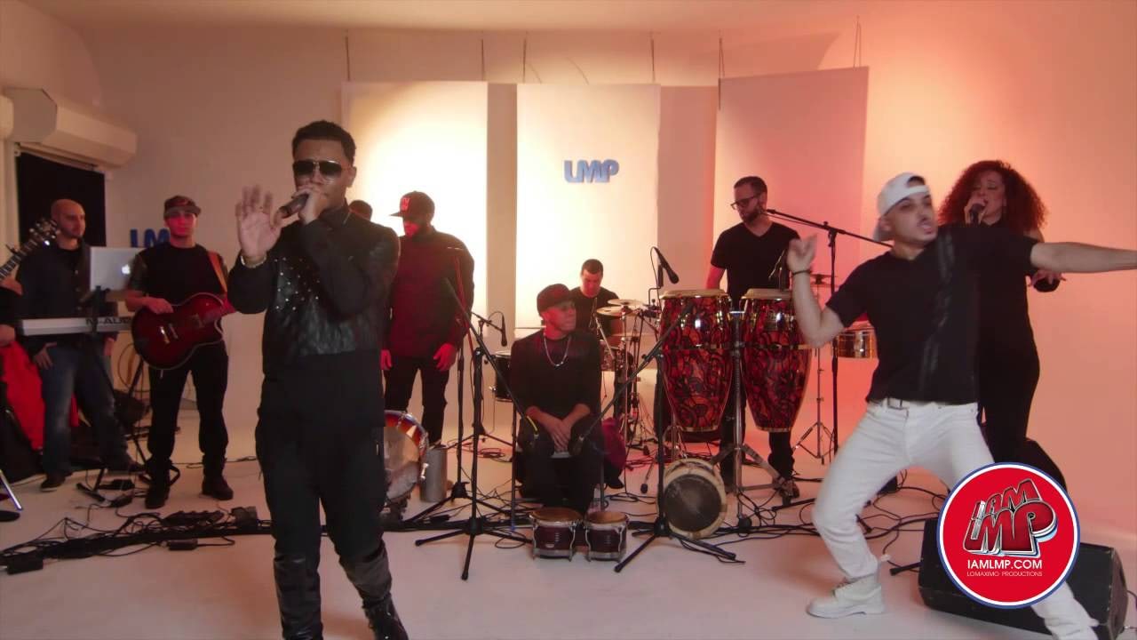 Toby Love performing “That Girl Is Mine”, a dancer and a backing singer beside him and the band behind