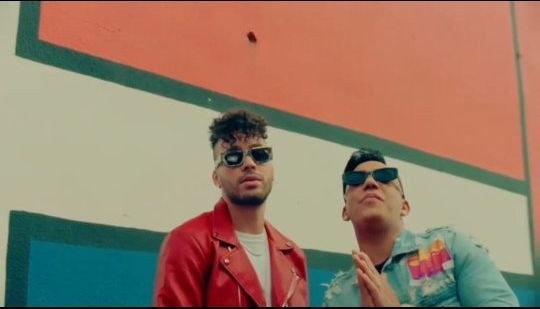 A frame from LMP's release reel for “Veterana”: Prince Royce and Elvis Martínez in the video